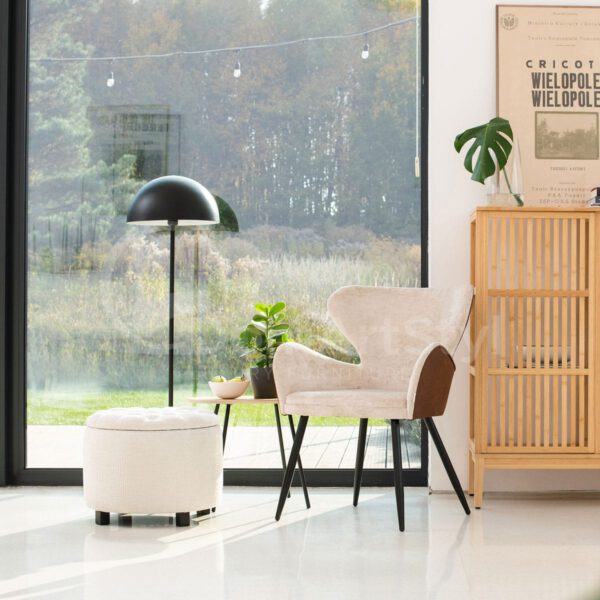 A modern beige velor armchair for the Paradise living room