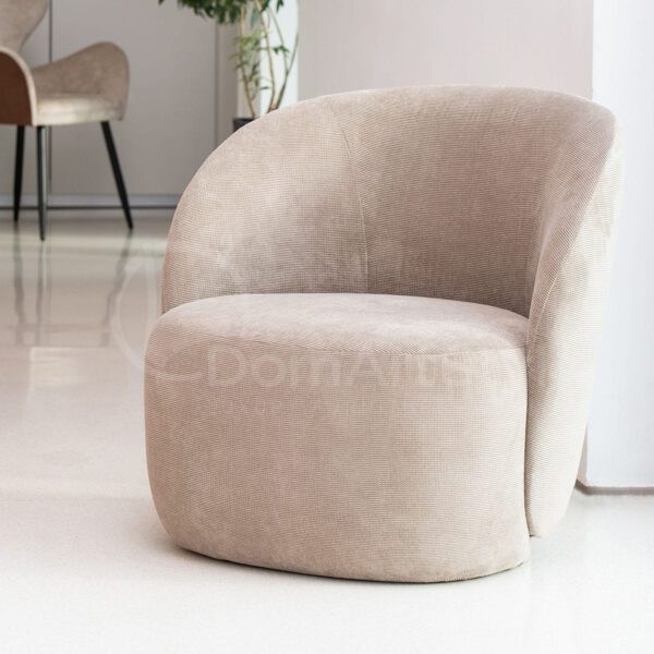 A modern velor armchair for the Venom living room