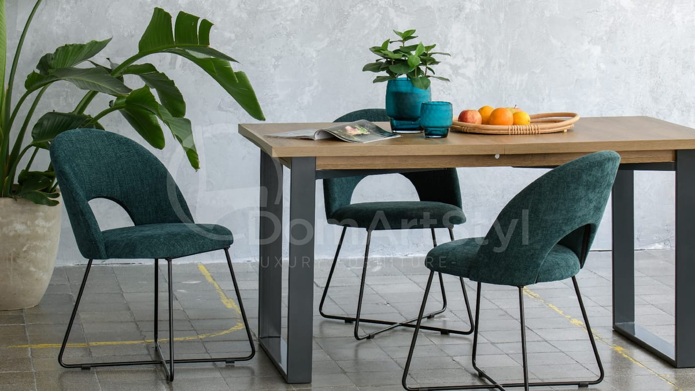 Dining room arrangement with modern green chairs