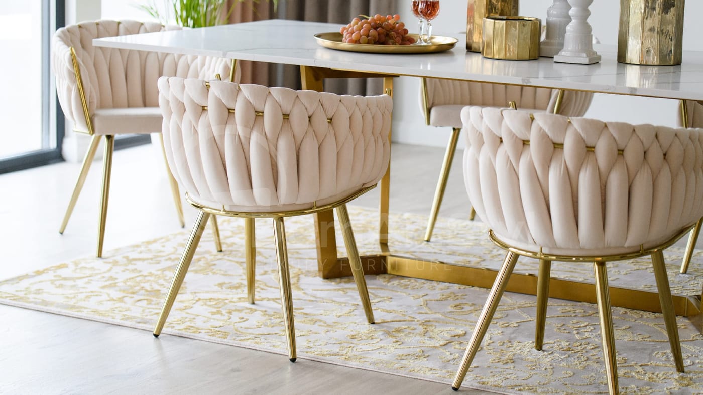Modern dining room design with white Larissa Gold velour armchairs