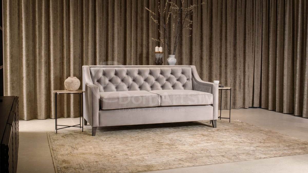 Grey chesterfield style two-seater sofa